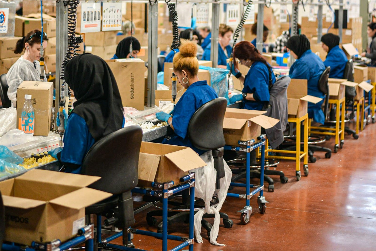 Workers on a textile factory production line