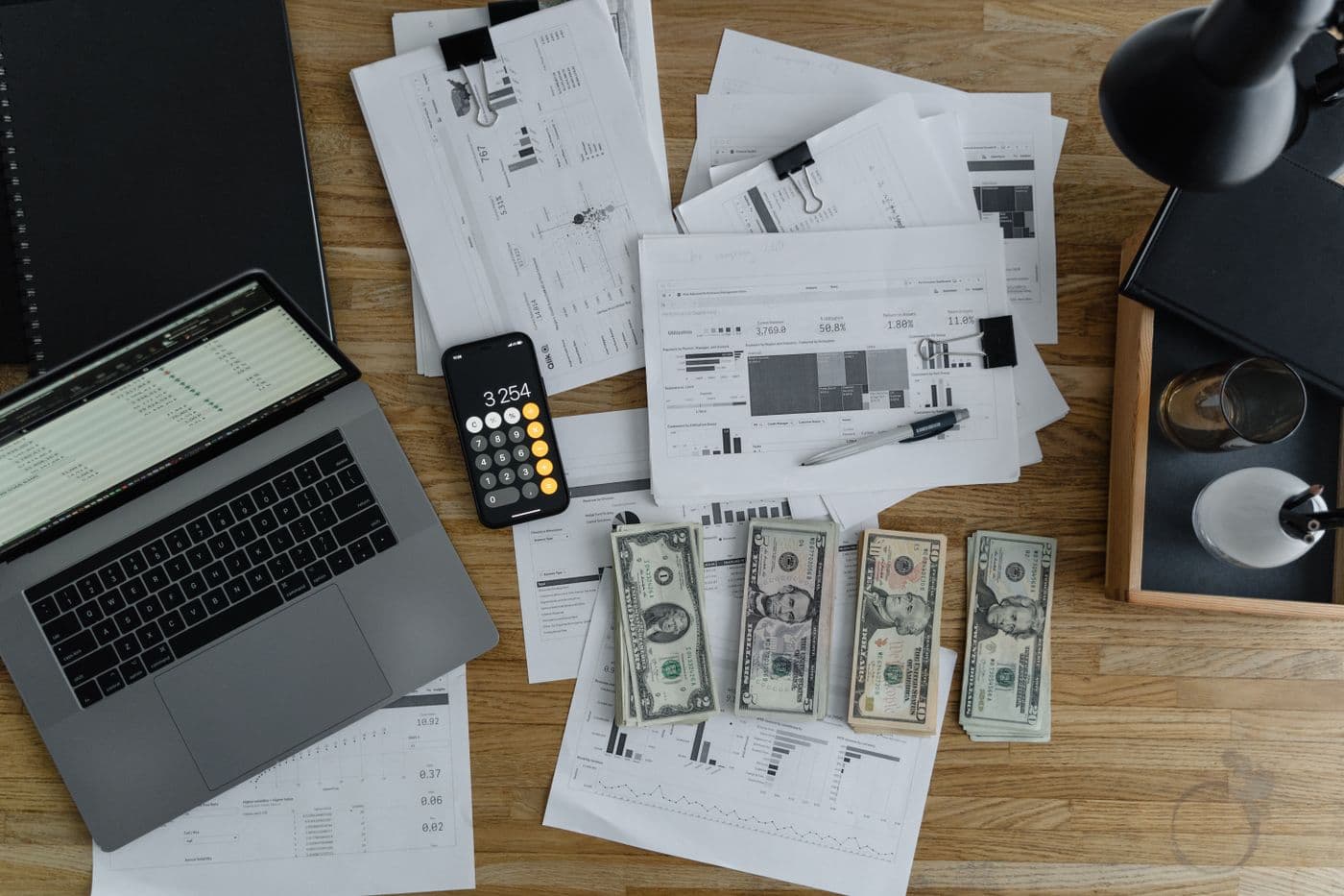 Person reviewing and signing salary and tax documents