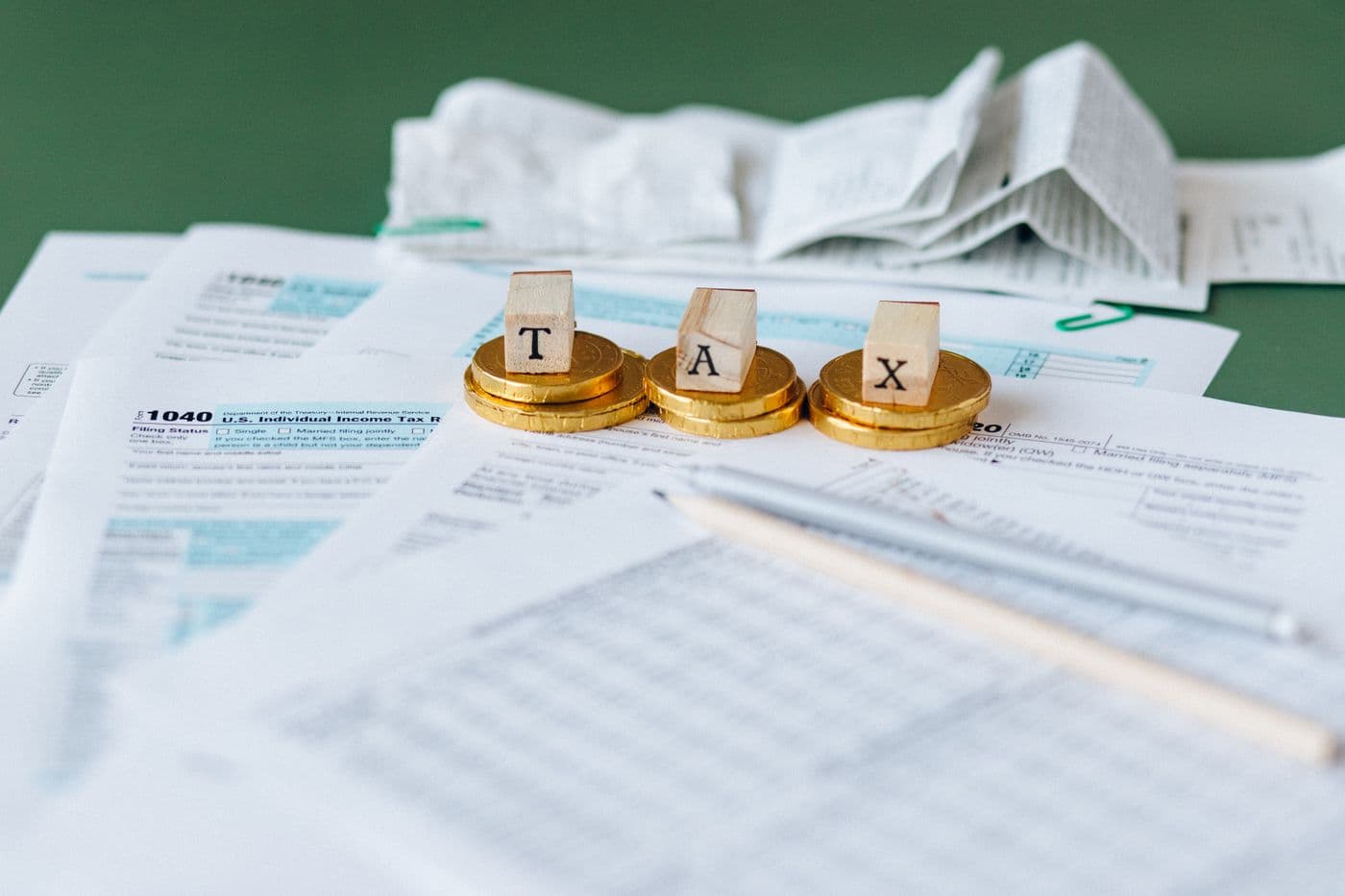 Calculator and tax paperwork on a desk used to work out salary income tax
